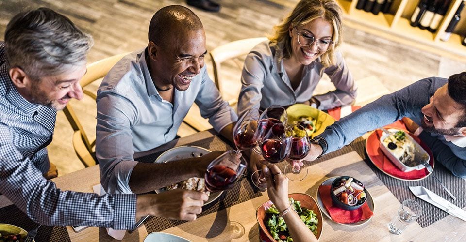 group toasting with wine